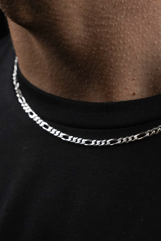 Silver chain necklace on a black shirt